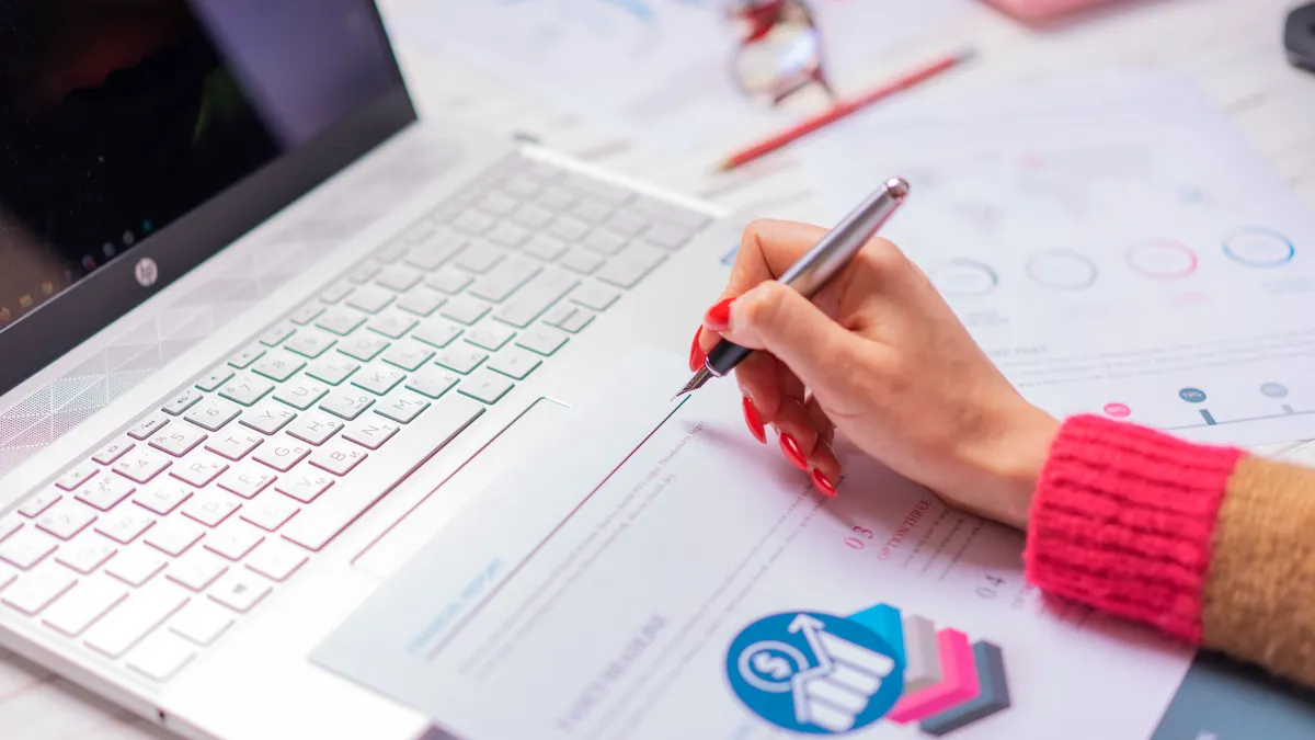 Best AI Writing SaaS for Budget Buyers — A Person Writing on a Paper