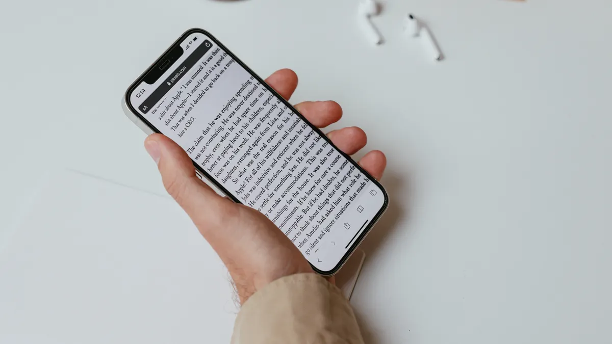 Best AI Writing SaaS for Long-Form Articles Best AI Writing SaaS for Long-Form Articles — A Person Writing While Holding a Smartphone