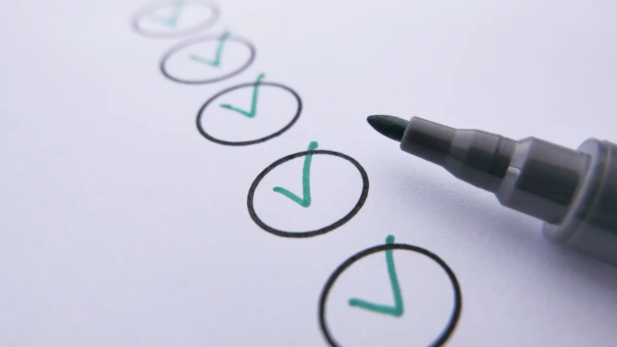 Evaluation, testing, and trust signals — The Complete Guide Pen checking off items in circles