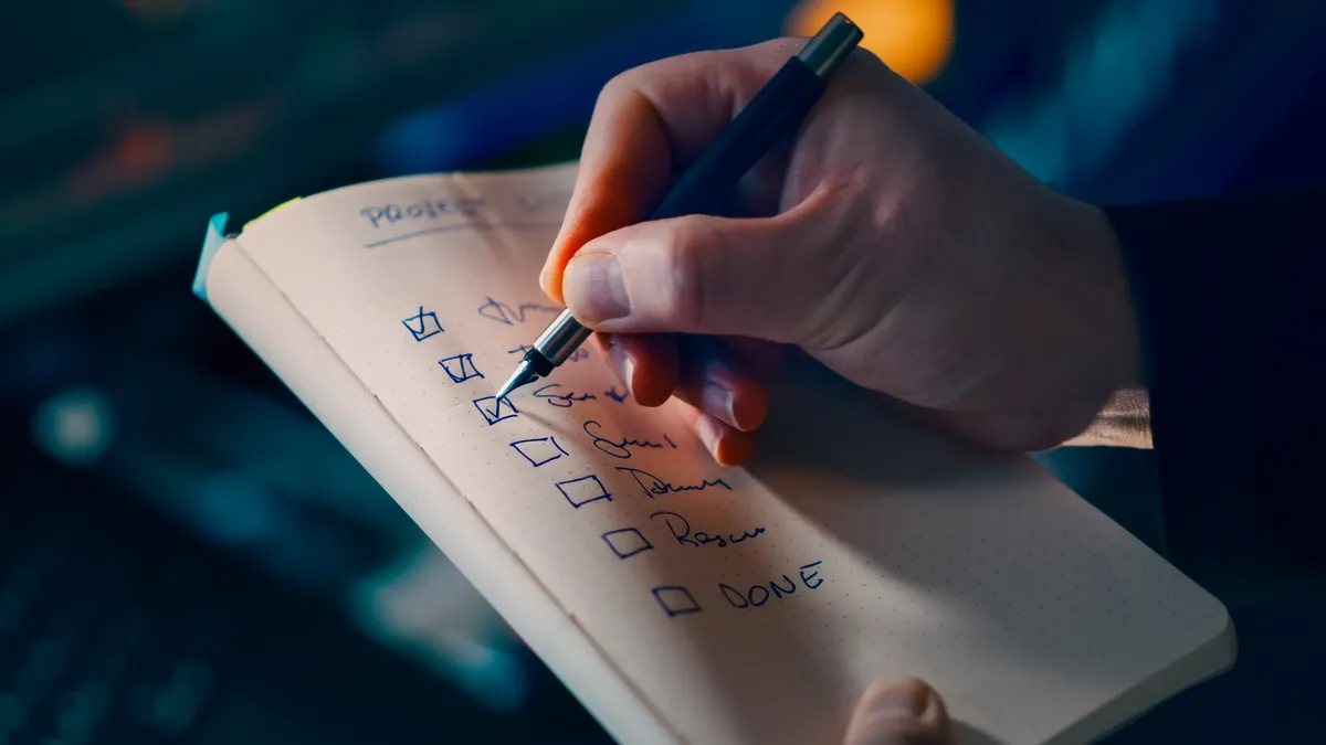 Evaluation, testing, and trust signals — The Complete Guide Hand ticking a checklist in a notebook