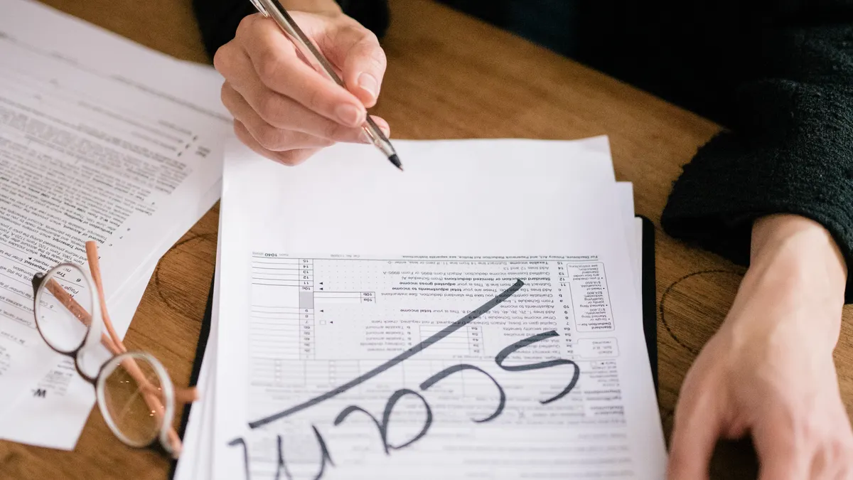 How We Check Claims in AI Writing SaaS Marketing — A Person Writing on a Document